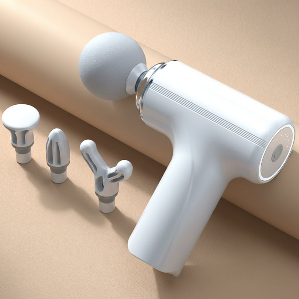 White handheld massage gun with attachments.